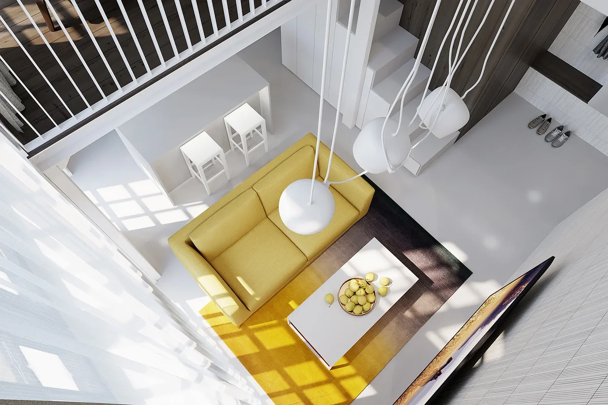 Dizajn interiéru loftového bytu v Žiline so žltou sedačkou, galériou a presvetleným otvoreným priestorom.
