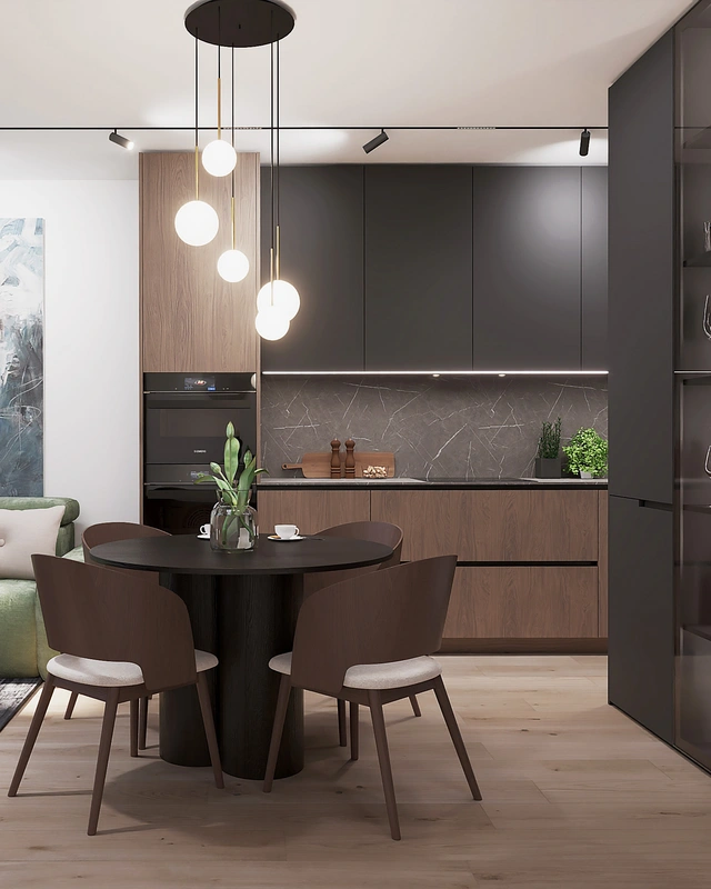 Interiérový dizajn bytu v Martine s čiernymi kuchynskými skrinkami, okrúhlym stolom a moderným osvetlením.
