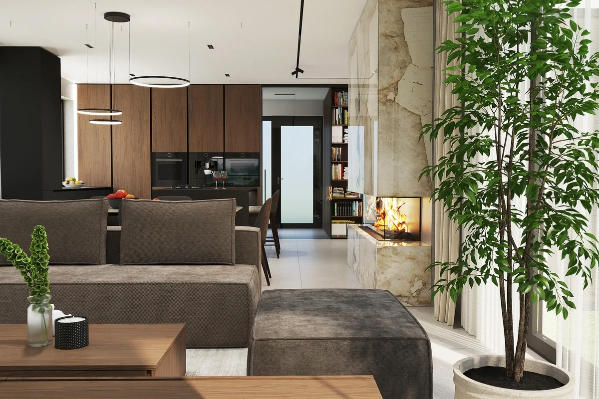 Interiérový dizajn rodinného domu s otvorenou kuchyňou, krbom a pohodlnou obývačkou v prírodných tónoch.